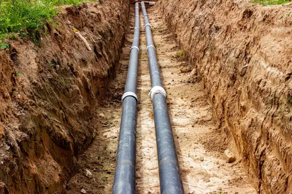 New sewer pipe installation in a trench