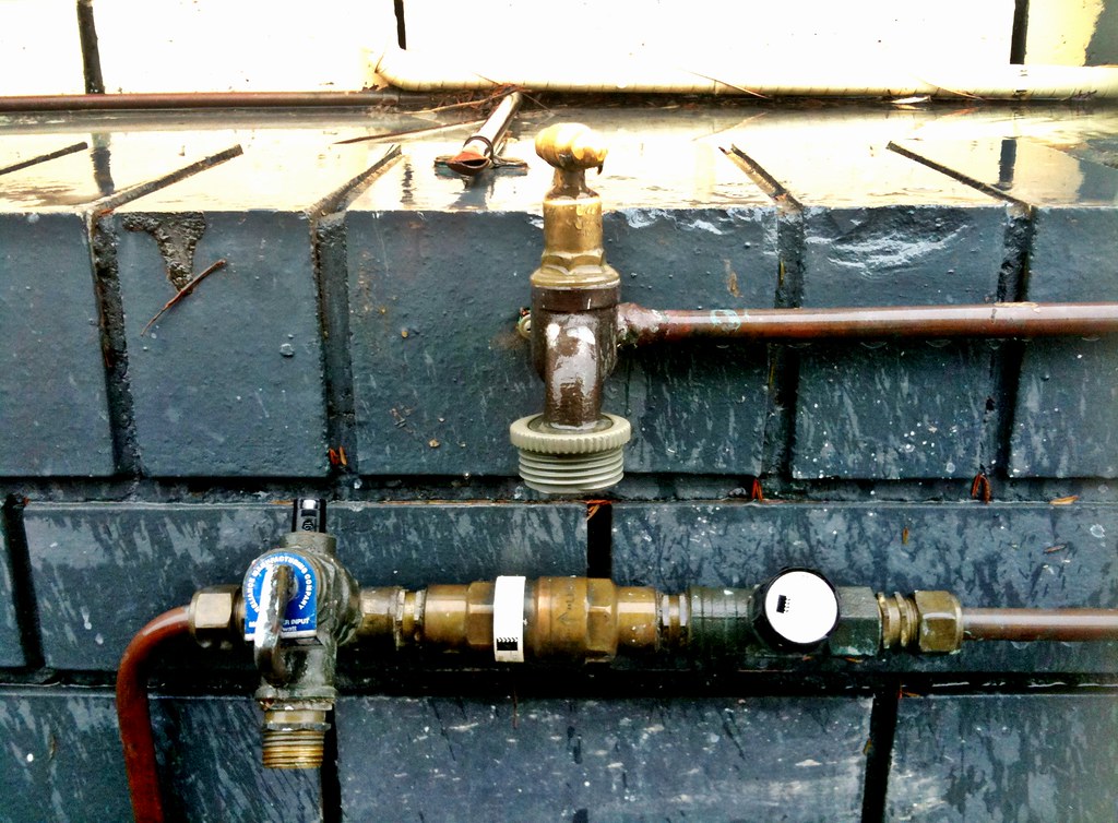 Existing copper water piping, valve, and meter connections